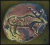Jewelry/pin cave painting, from handmade stamps on polymer clay, 1994