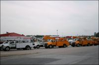 Electrical Company trucks driving southwest on Hwy 40 from Michegan, Kansas, Virginia, and Indiana to restore electricity in Louisiana and Mississippi after Hurricane Gustav